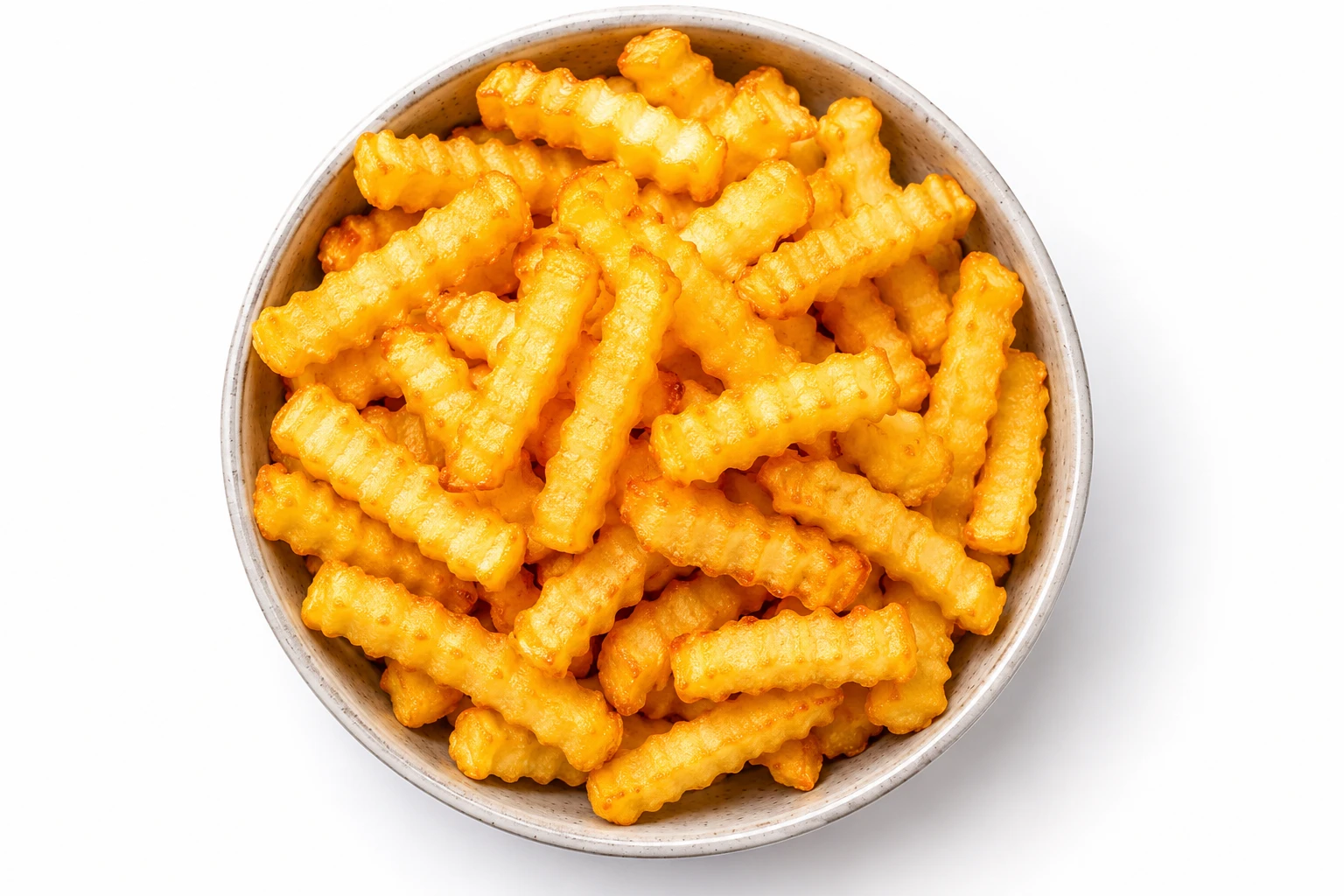 Pommes Eine Schüssel mit gewellten Pommes Frites